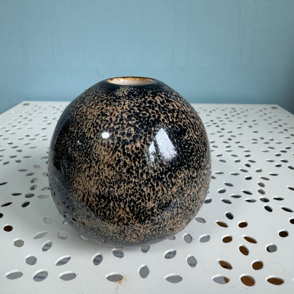 Signed Asian miniature bud vase, with speckled glaze.